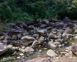 Stepping stones over river and small waterfall