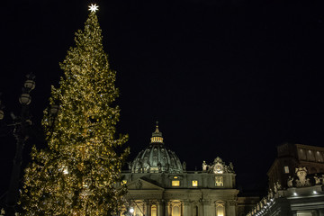 Rome Italy; 8 December 2019. In Piazza San Pietro the nativity scene reproduced with the wood of Trentino. With the Christmas tree in the background.