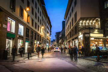 People in Florence at night