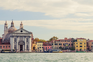 Fototapeta na wymiar Venice promenade with Church of Santa Maria della Salute in summer sunny day with a gondola sights of Italy in the Adriatic