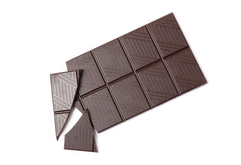 Black chocolate bar and pieces isolated on a white background.