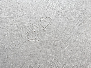 A painted heart on a wet white wall. Wall painting textured paint.