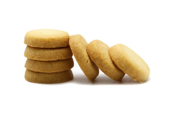 Fototapeta na wymiar Mini cookies sweet butter flavored. Biscuits of crunchy delicious sweet meal and useful cracker. Isolated on white background.
