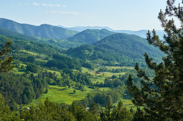 Fototapeta na wymiar Lush idyllic landscape with hills, valleys and pastures - Serbia