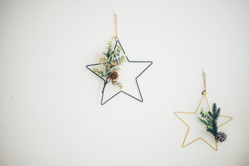 Christmas decorations in the shape of stars on the wall.
