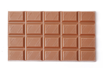 A bar of milk chocolate isolated on a white background. top view