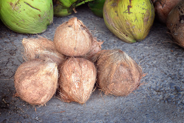 pile of coconuts are peeled to prepare for sell coconut water for tourists in Thailand market