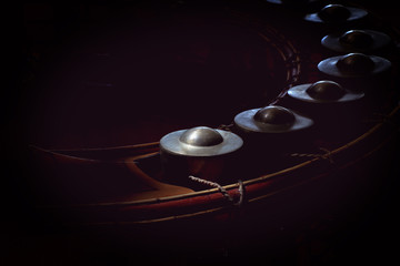small gongs or gongs wong in dark background, asia tradition percussion instrument, original Thai music instrument.