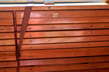 Empty wooden seat with a number twenty-six in a compartment of a vintage train