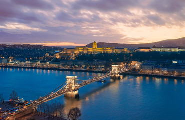 Sunset cityscape from Budapest with Danube river, Szechenyi chain bridge, Buda caslle, Varkert bazaar  and sandor palace.
