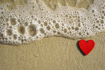 a red heart on the beach