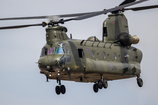 FAIRFORD, UK - JUL 13, 2018: UK Royal Air Force CH-47 Chinook cargo helicopter in flight over RAF Fairford airbase.