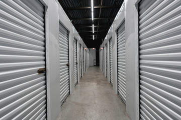 Storage warehouse interior. Metal garage doors with locks