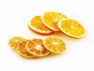 A few slices of oranges and lemons on a white background