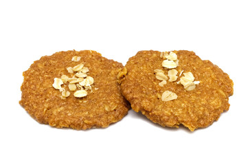 Biscuits homemade Oatmeal flavoured and Thin style. Stack of crunchy delicious sweet meal and useful cookies. Isolated on white background.