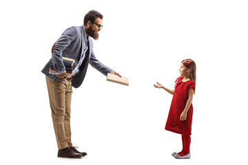 Male teacher giving a book to a girl