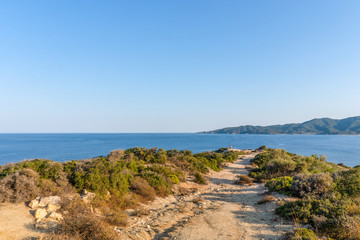 Fototapeta na wymiar Sandy road to the sea in Greece