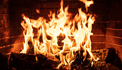 Burning fireplace, real wood logs, cozy warm home at xmas time