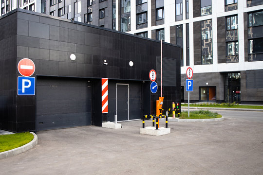 Sign of Entrance to the underground parking. View of new modern apartment house. Residential complex in Europe. .