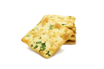 Biscuits cracker square design.Great flavor combination of green onion and wheat. Isolated on white background.