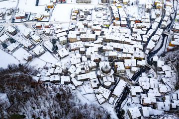 Valtellina (IT) - Panoramic aerial view of Sirta village in winter
