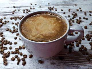  close-up of a hot drink, a large cup of coffee / cocoa on a background of abstract wooden surface
