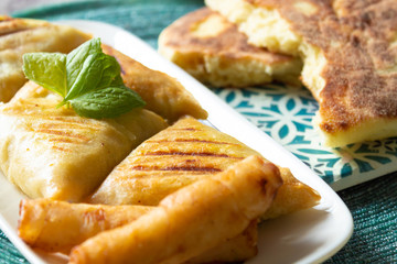 Arab chicken briwats on white plate