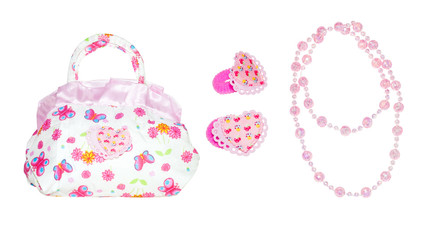 Baby bag, hair bands and beads on a white isolated background. Children's set for girls with butterflies and flowers.