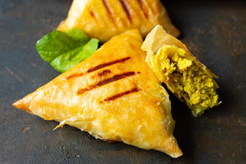 Arab chicken briwats on white plate