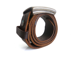 Dark brown leather belt with metal buckle, female accessory. Isolated on white background