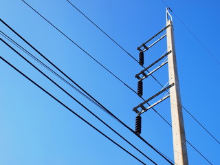 High voltage on the pole On the blue sky background With copy space