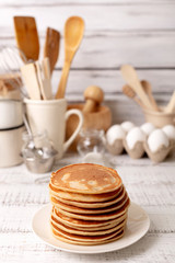 Cooking pancakes. Ingredients, crockery and kitchenware for pancakes.
