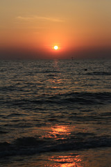 The beautiful light of the sunset at the sea. Mae Ramphueng Beach, Taphong Subdistrict, Mueang Rayong District, Rayong Province, Thailand