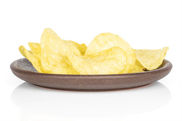 Lot of whole crisp potato chip with brown ceramic coaster isolated on white background
