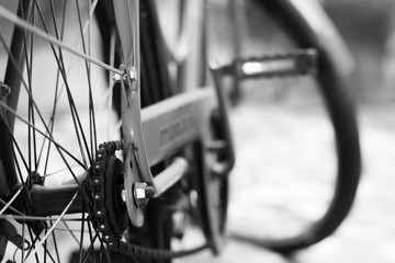 Fototapeta na wymiar Gears of an old bicycle, black and white photography