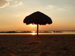 umbrella on beach, sunset