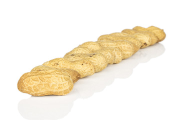 Lot of whole tasty beige peanut diagonal isolated on white background