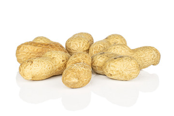 Group of eight whole tasty beige peanut isolated on white background