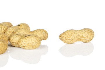 Lot of whole tasty beige peanut isolated on white background