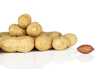 Lot of whole one piece of tasty beige peanut isolated on white background