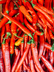 lots of red hot peppers for eating on the table as the background