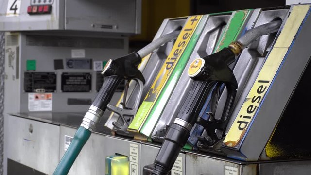 taly , Milan december 15,2019 - to make gasoline to the car - Eni petrol pump in the city - green petrol, diesel and diesel +