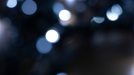 Abstract light, bokeh effect, new year lights. Dark background, bokeh light.