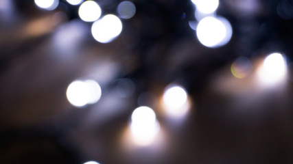 Obraz premium Abstract light, bokeh effect, new year lights. Dark background, bokeh light.