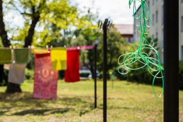 Clothesline with laundry that dries outdoors in the sun, Clothesline with laundry, sunny warm day
