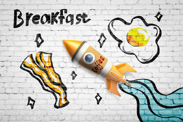 3d rendering of toy rocket made of coffee cup against white brick wall with drawings of eggs and bacon, and title 'Breakfast'.