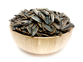 Sunflower seeds in bowl isolated on white background.Roasted, Salted in the original flavor.Great nutritous and rich with oil which makes it a high energy source.Snack for diet and healthy.