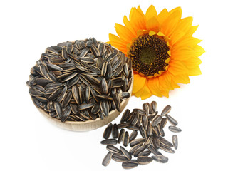 Sunflower seeds pile against isolated on white background. Roasted and Salted in the original flavor. Great nutritous and rich with oil which makes it a high energy source. Snack for diet and healthy.