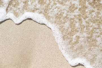 Calm sea wave on the sandy beach. Photo background