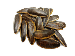 Sunflower seeds pile against isolated on white background. Roasted and Salted in the original flavor. Great nutritous and rich with oil which makes it a high energy source. Snack for diet and healthy.